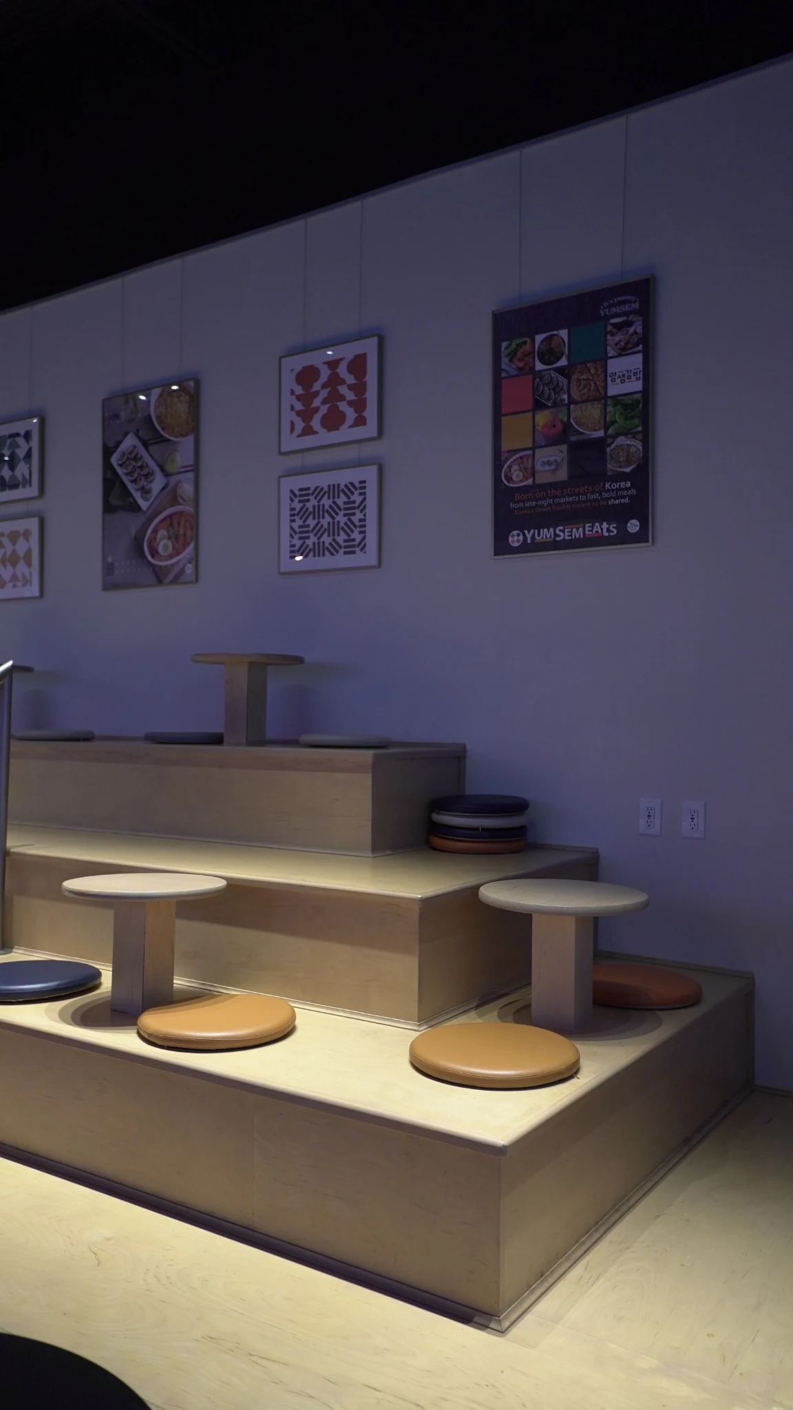 Korean-inspired tiered seating area inside YumSem Eats